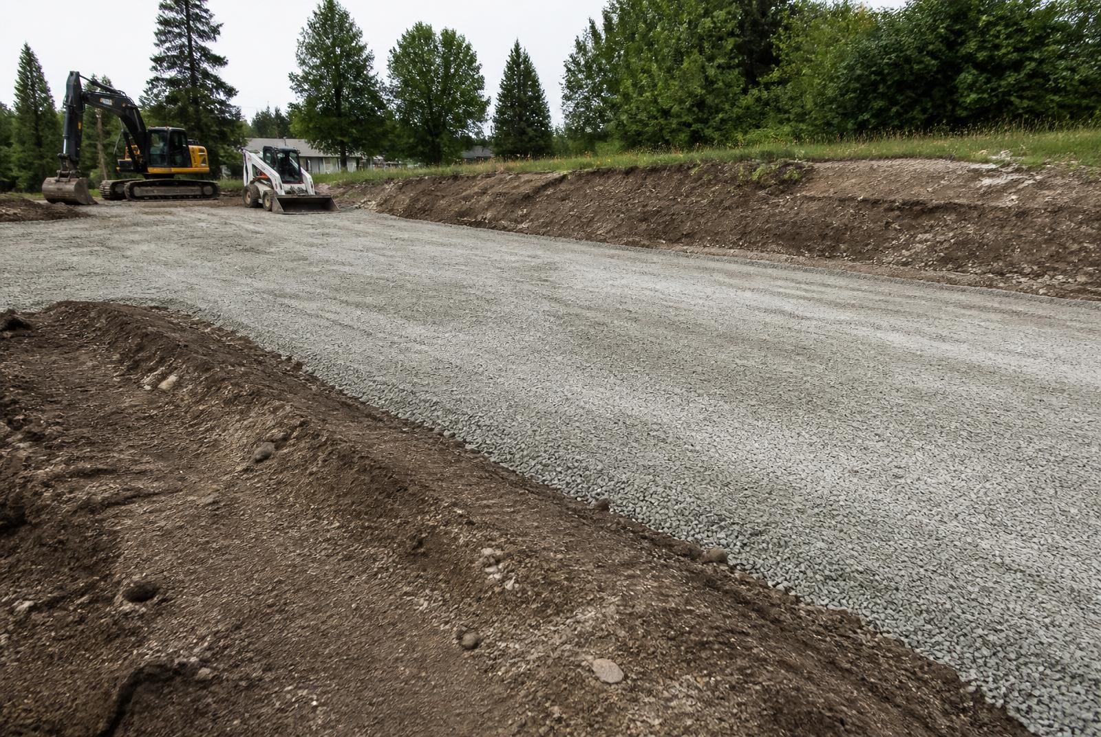 Compacted crushed stone base graded for a new driveway